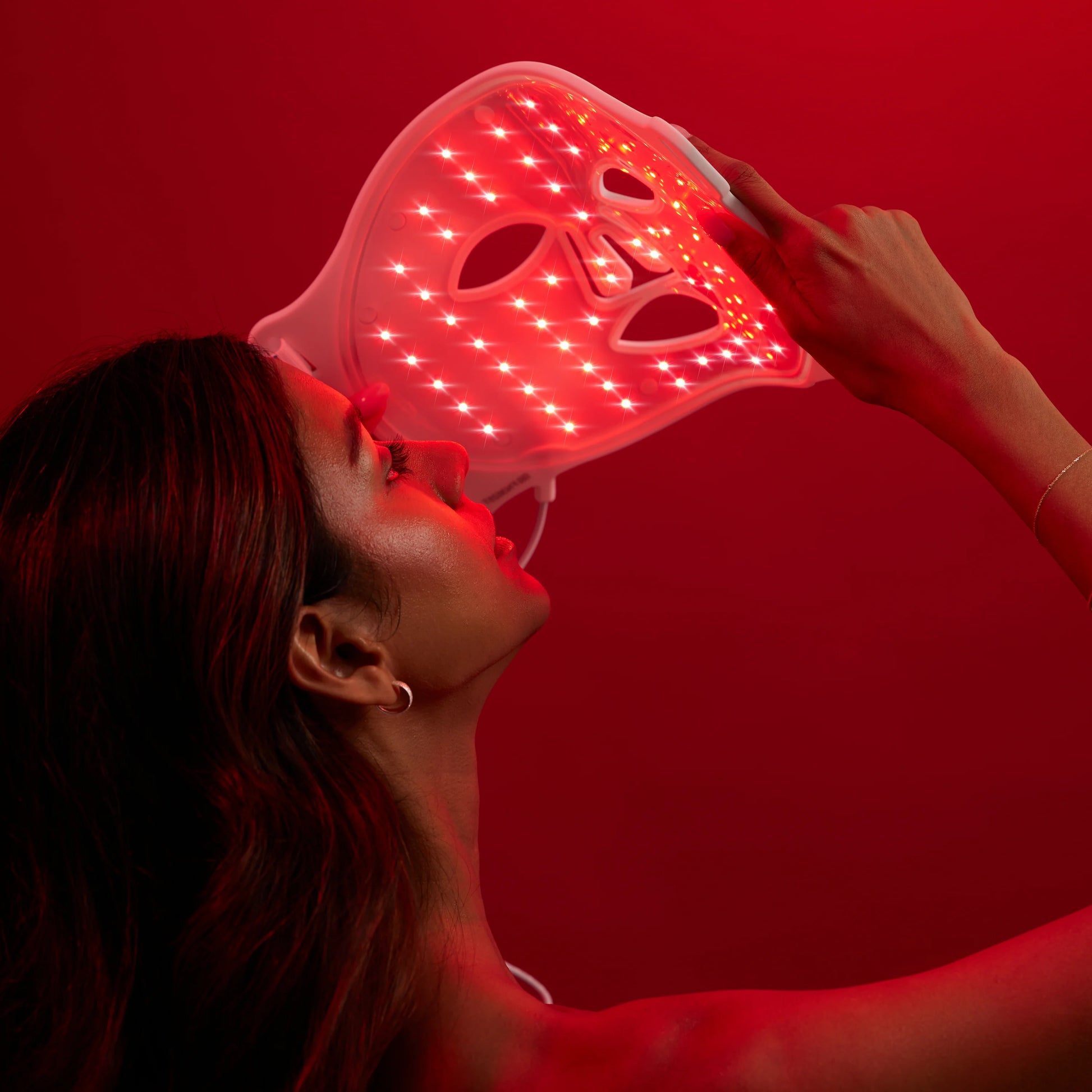 Red light mask being put on